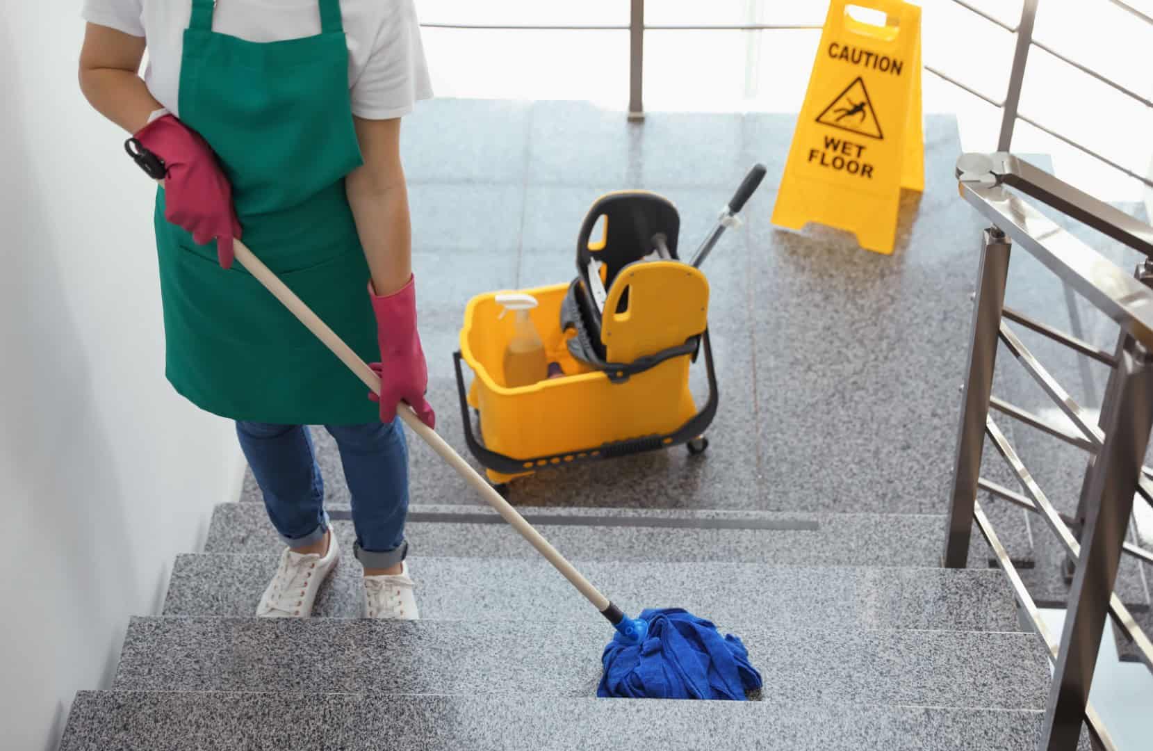 Woman cleaning commercial stairs